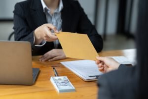 Businessman submitting legal documents litigation in agreement contract.